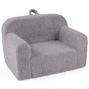 Grey teddy-fleece foam armchair, angled view with carry handle