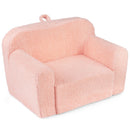 Pink teddy-fleece foam armchair, angled view with carry handle