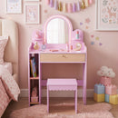 Pink kids vanity and storage stool in a styled bedroom with example toys and accessories