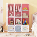 Pink wardrobe with open cube compartments and two hanging rails, staged with clothes and toys