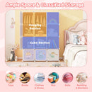 Pink panel wardrobe showing two hanging sections and cube compartments with example clothes and toys