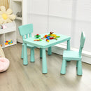 Green kids plastic table and two-chair set: lifestyle with toy props.