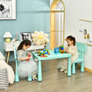 Green kids plastic table and two-chair set: two children playing in a room.