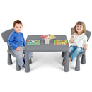 Grey kids plastic table and two-chair set: two children using the set.