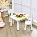 White kids plastic table and two-chair set: lifestyle with toy props.