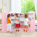 Pink corner play kitchen with three children at play