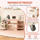 Pink pretend doctor station showing the toy trolley handle, lower storage area and caster wheel