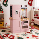 Pink dual-sided wooden play kitchen in a styled room; decorations are not included