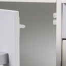 White close-up of the play kitchen cupboard door catch