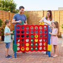 Blue uprights and coloured four-in-a-row board shown during an outdoor family game