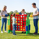 Green uprights and four-in-a-row board shown on grass during supervised play