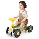 Child seated on train ride-on – Green