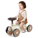Child seated on train ride-on – Beige