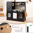 Wooden play kitchen with chalkboard and toy ice dispenser, Black — wall anchoring detail and room setting
