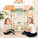 Multicolour wooden dollhouse shown in a playroom