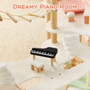 Miniature piano and stool in the central dollhouse room