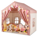 Pink two-door play tent with star lights and pennant banner; decorative props not included