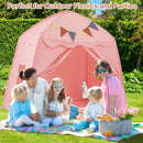 Pink dome play tent behind adults and children at an outdoor picnic; picnic items and blanket not included