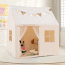 Beige playhouse tent staged in a room with example books, cushions and toys that are not included