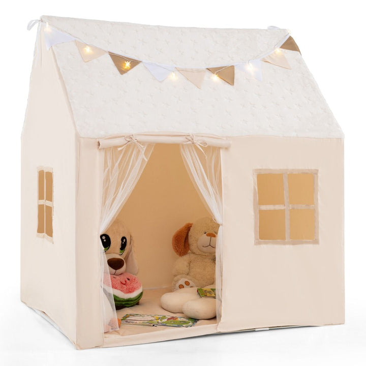 Beige house-shaped play tent with mesh doorway, two windows, star roof, pennants and decorative light string