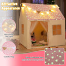 Pink playhouse tent with details of its star light string, pennants and glow-in-the-dark roof pattern
