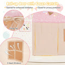 Pink-roof play tent showing the roll-up door ties, closed fabric door and mesh windows