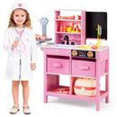 Child beside the pink doctor play centre and its toy accessories