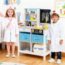 Children beside the white doctor play centre with example dress-up clothing