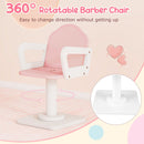 Pink barber-style chair showing its pedestal base, armrests and swivel movement