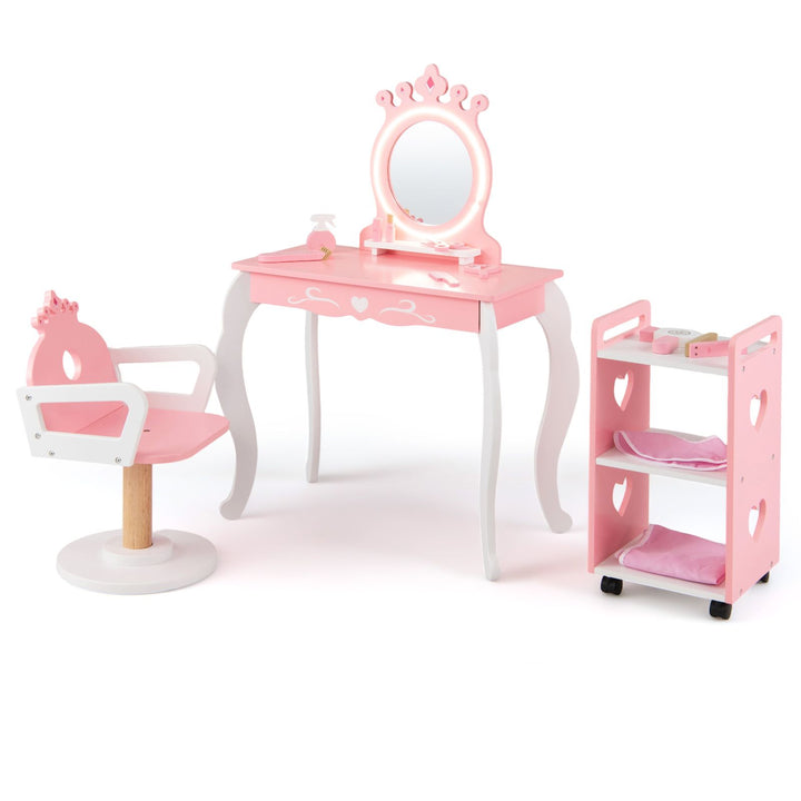 Pink crown salon vanity with oval lighted mirror, curved white legs, swivel chair and heart-cutout trolley