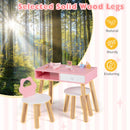 Natural pine legs beneath the pink table and white round seats
