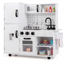 White and black play kitchen showing cupboards, open shelves, utensil hooks and towel rail; extra accessories are styling props