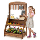 Brown wooden market stand beside a child, showing the serving counter and lower bin