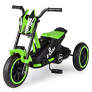 Green and black motorcycle-styled pedal tricycle with three wheels, low seat and E&M body graphics viewed from the opposite front angle
