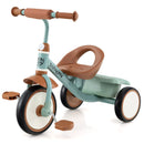 Green and brown pedal tricycle with rear basket on a white background
