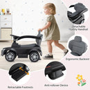 Toddler toy car shown in walk-behind play with removable side rail, backrest and retractable footrests