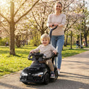 Black toddler toy push car shown with an adult using the parent handle