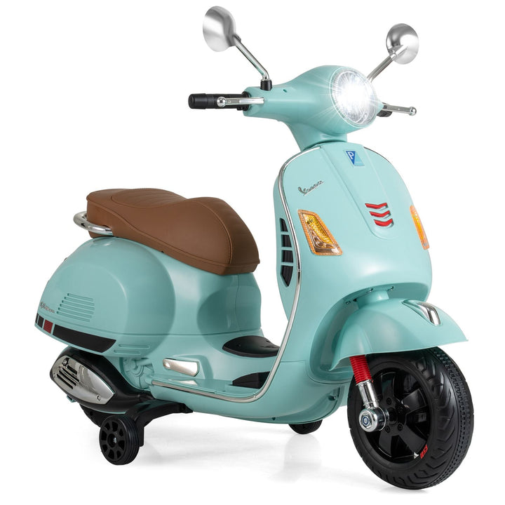 Green kids electric scooter with both training wheels fitted
