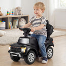 Black toy push car in child-powered ride-on configuration
