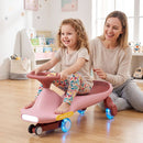 Pink wiggle car during supervised foot-to-floor play