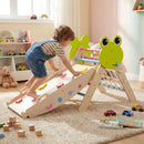 Child using the climbing face of the frog climbing set ramp