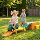 Green ride-on car and three-colour track shown on a lawn