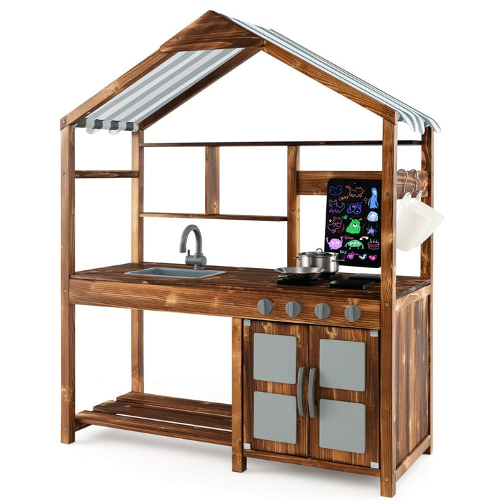 Natural wooden mud kitchen with striped pitched canopy, sink, four pretend hob plates, chalkboard and storage cabinet