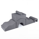 Grey six-piece foam play set with two slopes, a bridge, cylinder and nested arches