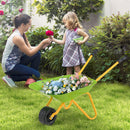 Light Green wheelbarrow in a supervised garden scene with example flowers