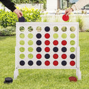 White wooden four-in-a-row game with red and blue chips during outdoor play