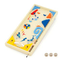 Opposite angle of the wooden pinball game showing dual flippers, launcher and three metal balls