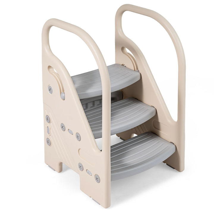 Three-step toddler stool with grey treads, beige side frames and raised handrails