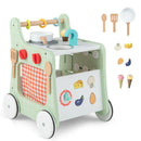 Green wooden play kitchen push walker with included toy food and cookware